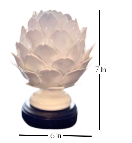 Decorative white artichoke-shaped art piece with measurements on a white background