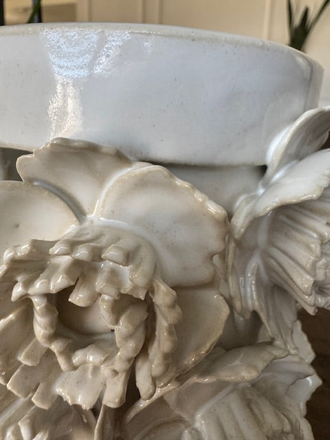 Close-up of a marble flower sculpture with intricate details.